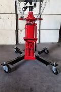 "Double piston 2-stage hydraulic transmission jack with red steel frame"

"1320 lb telescopic transmission lift jack for vehicle maintenance"

"Heavy-duty transmission jack with foot pump and swivel casters"
