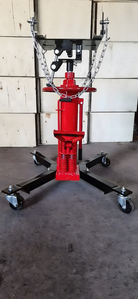 "Double piston 2-stage hydraulic transmission jack with red steel frame"

"1320 lb telescopic transmission lift jack for vehicle maintenance"

"Heavy-duty transmission jack with foot pump and swivel casters"