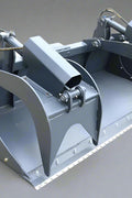 Dual cylinder scrap grapple for skid steer

Heavy-duty skid steer attachment with open side design

Top view of 85" grapple bucket with reinforced build

Grapple arms closed over large debris

