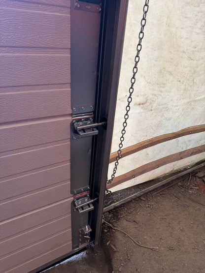 White insulated electric overhead garage door installed in shop
Heavy-duty motorized overhead garage door with steel frame
Electric garage door kit with insulation for industrial buildings
Overhead sectional garage door installed on warehouse