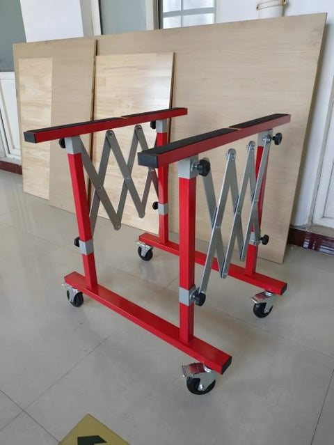 Red expanding folding table with padded surface for windshield and body panel work

