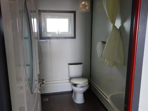 "Foldable insulated container home with windows and door – 19FT model"

"Portable prefab tiny home cabin for off-grid living and remote offices"

"Modular container house interior layout – white insulated walls and windows"