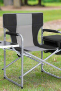 Heavy-duty folding camping chair with side table
Black outdoor director’s chair with cooler bag
Close-up of built-in cup holder and folding frame
Portable folding chair folded and packed for storage
Camping chair in use outdoors near a tent and a cooler
