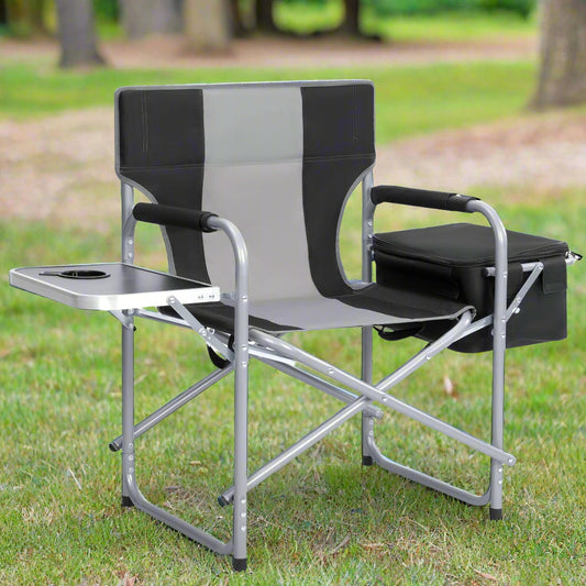 Heavy-duty folding camping chair with side table
Black outdoor director’s chair with cooler bag
Close-up of built-in cup holder and folding frame
Portable folding chair folded and packed for storage
Camping chair in use outdoors near a tent and a cooler