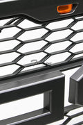 Front view of Ford F-150 with Raptor style grille installed
Close-up of honeycomb mesh design
Back of grill with wiring harness
LED light bars and connectors
Grill with lights turned on
