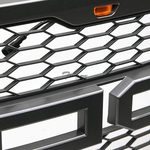 Front view of Ford F-150 with Raptor style grille installed
Close-up of honeycomb mesh design
Back of grill with wiring harness
LED light bars and connectors
Grill with lights turned on