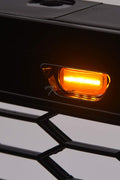 Front view of Ford F-150 with Raptor style grille installed
Close-up of honeycomb mesh design
Back of grill with wiring harness
LED light bars and connectors
Grill with lights turned on