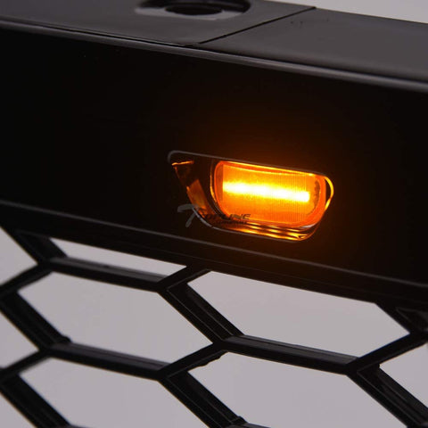 Front view of Ford F-150 with Raptor style grille installed
Close-up of honeycomb mesh design
Back of grill with wiring harness
LED light bars and connectors
Grill with lights turned on
