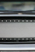 Black rivet mesh grille installed on Ford F-250
Side view of FDGRL48 grille finish and build
Close-up of stainless steel mesh and rivets
Black powder-coated grille laid flat
Packaging and grille kit contents