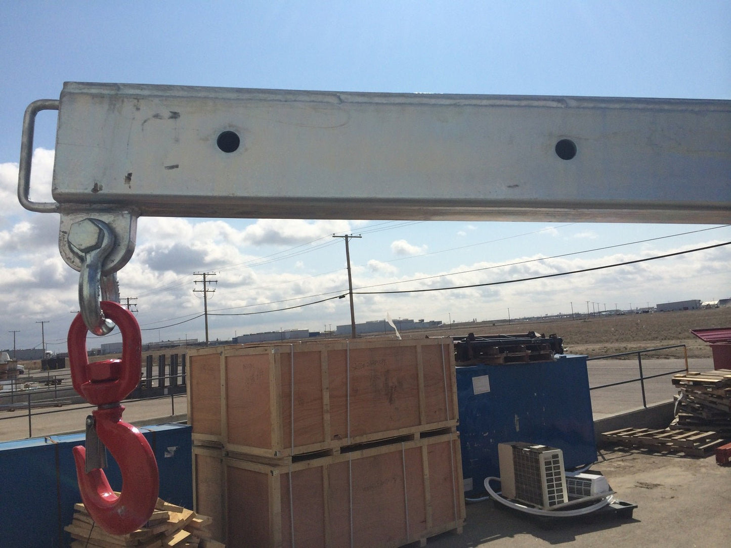 Forklift lifting beam with extension jib attachment
Heavy-duty skid steer jib arm in use
Zinc-coated forklift boom arm – extended
Safety hook and shackle close-up
Forklift lifting with boom attachment in construction site