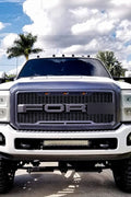 Main product view of matte black grille for Ford F-series
Close-up of grille mesh and LED lighting
Grille installed on F-250 front end
Unboxed grille showing hardware and wiring
Top view of grille showing LED connections
Front view comparison: before and after install
Off-road lighting activated at night