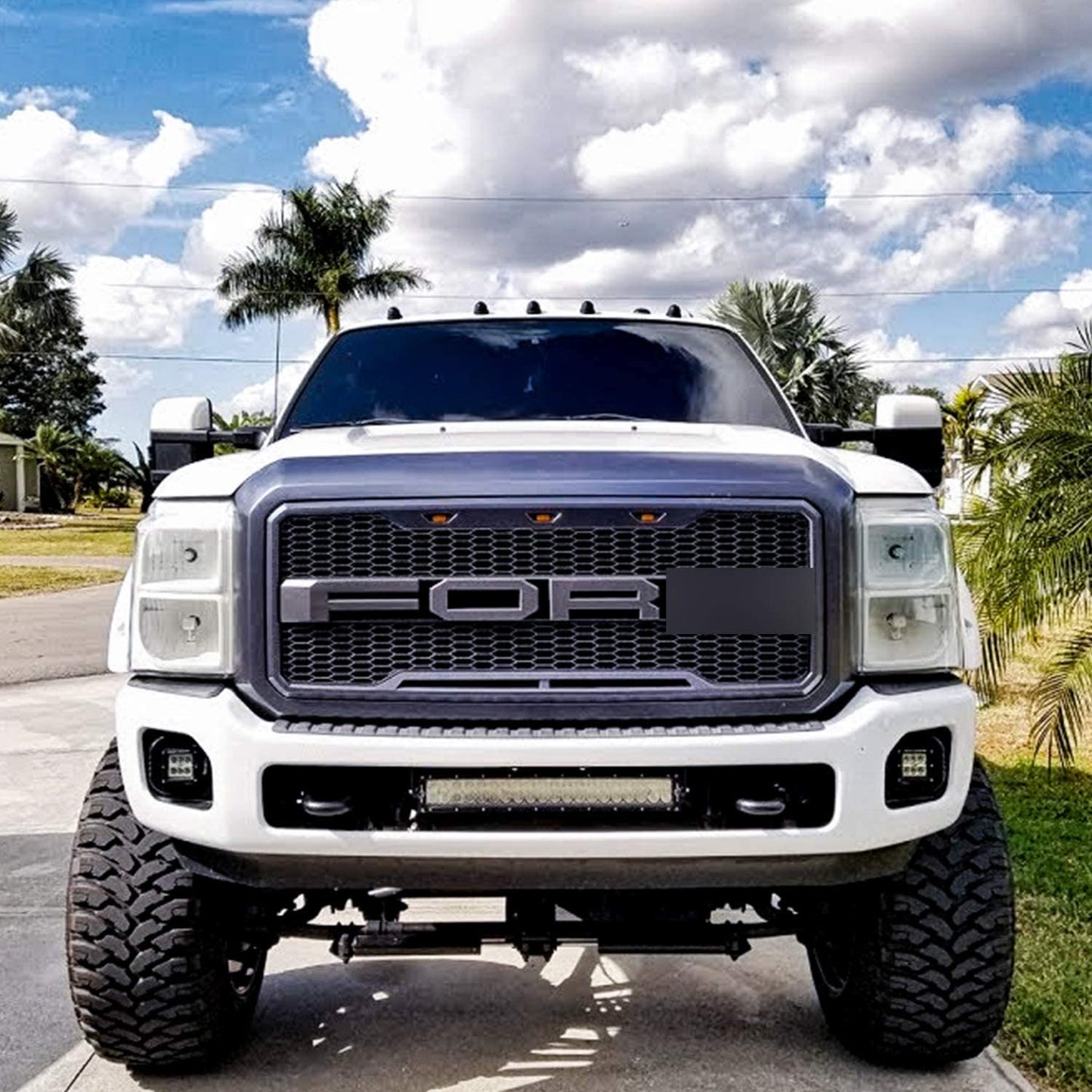 Main product view of matte black grille for Ford F-series
Close-up of grille mesh and LED lighting
Grille installed on F-250 front end
Unboxed grille showing hardware and wiring
Top view of grille showing LED connections
Front view comparison: before and after install
Off-road lighting activated at night