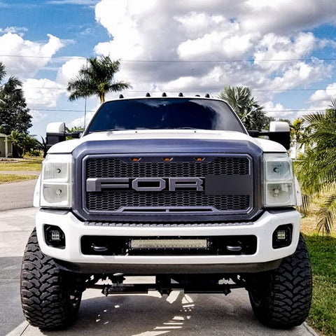 Main product view of matte black grille for Ford F-series
Close-up of grille mesh and LED lighting
Grille installed on F-250 front end
Unboxed grille showing hardware and wiring
Top view of grille showing LED connections
Front view comparison: before and after install
Off-road lighting activated at night