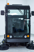 Fully enclosed ride-on industrial floor sweeper in green
Electric road sweeper with 200L tank and enclosed cabin
Commercial cleaning machine for streets and factories
High-capacity ride-on floor sweeper with water tank