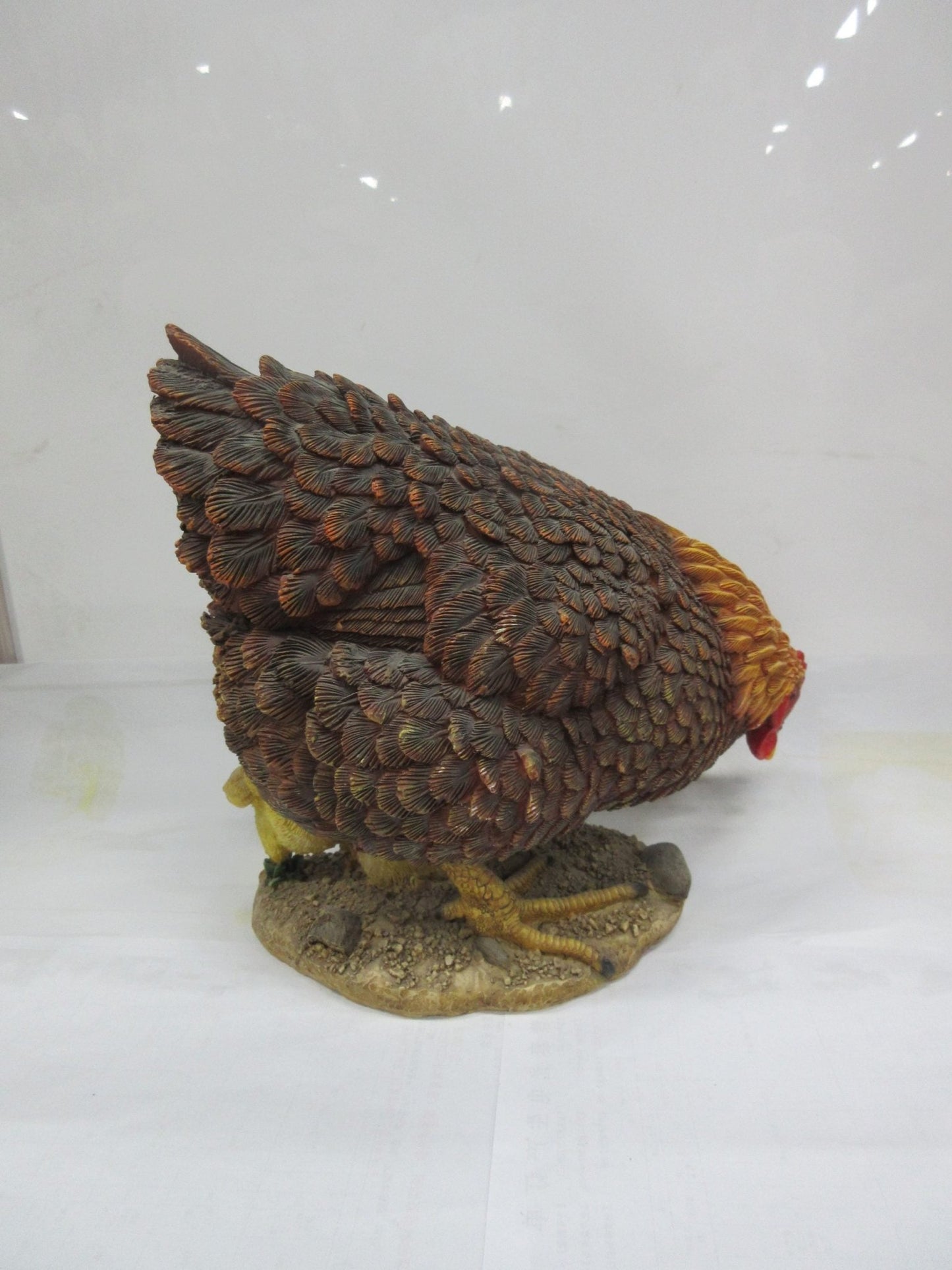 Realistic resin chicken and chicks statue on outdoor display
Close-up of hand-painted hen and baby chicks sculpture
Weather-resistant garden chicken ornament
Farmhouse-style chicken décor for patio or garden
Lifelike hen with chicks resin statue for outdoor and indoor use