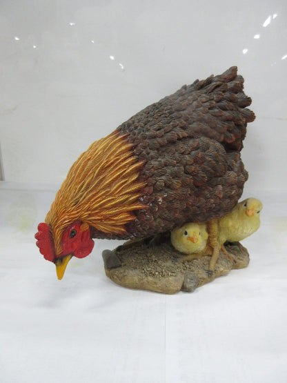 Realistic resin chicken and chicks statue on outdoor display
Close-up of hand-painted hen and baby chicks sculpture
Weather-resistant garden chicken ornament
Farmhouse-style chicken décor for patio or garden
Lifelike hen with chicks resin statue for outdoor and indoor use
