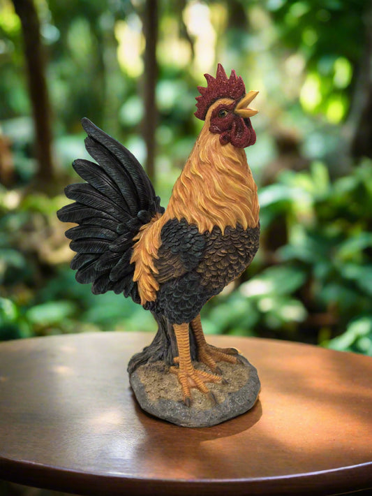 Front view of hand-painted crowing rooster garden statue on patio