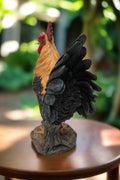 Close-up of tail feathers and sturdy base on rooster sculpture