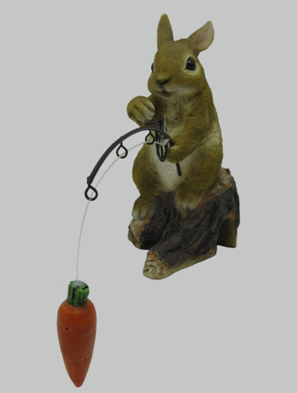 Hand-painted resin carrot fishing bunny garden statue
Whimsical outdoor bunny figurine with carrot pole
Close-up of resin bunny fishing statue for garden décor