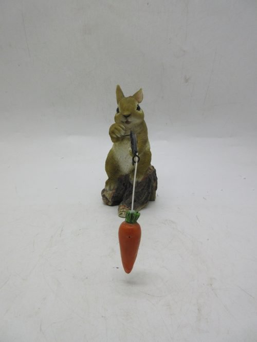Hand-painted resin carrot fishing bunny garden statue
Whimsical outdoor bunny figurine with carrot pole
Close-up of resin bunny fishing statue for garden décor