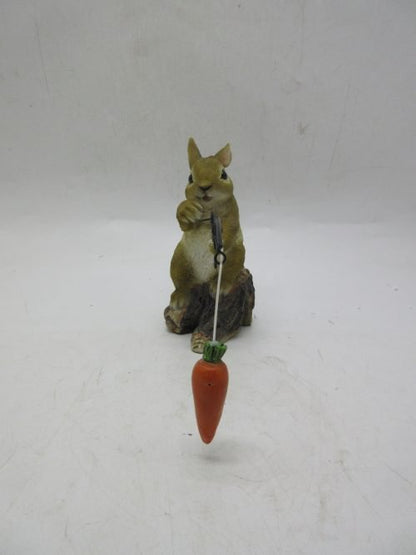 Hand-painted resin carrot fishing bunny garden statue
Whimsical outdoor bunny figurine with carrot pole
Close-up of resin bunny fishing statue for garden décor
