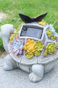 Solar turtle garden statue with LED lights and succulents
Whimsical outdoor turtle figurine with butterfly light
Resin turtle statue with solar-powered garden lighting