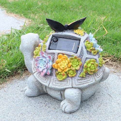 Solar turtle garden statue with LED lights and succulents
Whimsical outdoor turtle figurine with butterfly light
Resin turtle statue with solar-powered garden lighting