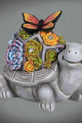 Solar turtle garden statue with LED lights and succulents
Whimsical outdoor turtle figurine with butterfly light
Resin turtle statue with solar-powered garden lighting