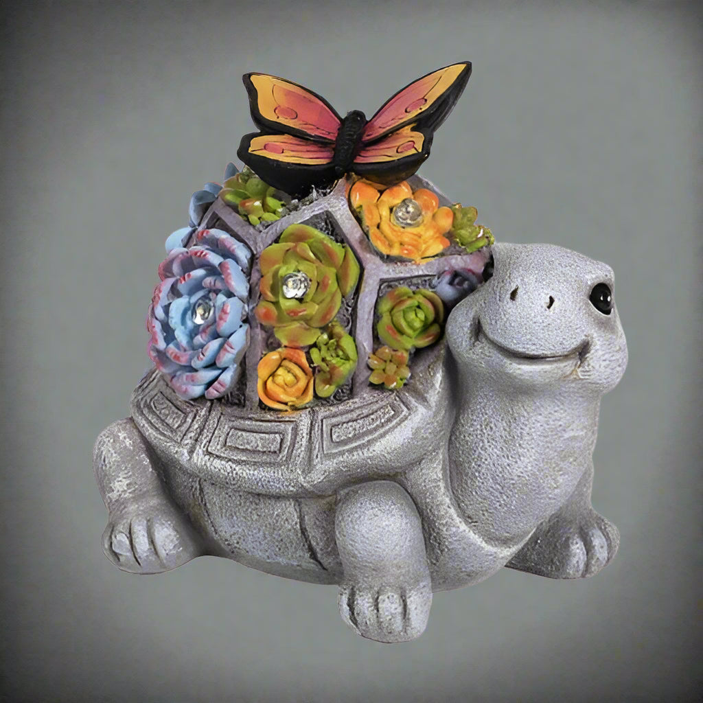 Solar turtle garden statue with LED lights and succulents
Whimsical outdoor turtle figurine with butterfly light
Resin turtle statue with solar-powered garden lighting