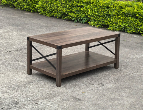 Gray wash rustic coffee table with metal X-frame in the living room
Front view of the coffee table showing shelf storage
Side angle showing gray tabletop and open shelf
Coffee table outdoors with accessories
Detail of gray wash wood and black frame