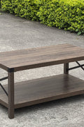Gray wash rustic coffee table with metal X-frame in the living room
Front view of the coffee table showing shelf storage
Side angle showing gray tabletop and open shelf
Coffee table outdoors with accessories
Detail of gray wash wood and black frame