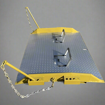 Heavy-duty steel loading dock ramp on warehouse floor

Industrial dock ramp with yellow safety rails

Forklift-ready steel dock board in use

Side view of 15,000 lb steel dock ramp

Loading dock ramp with chain attachment system