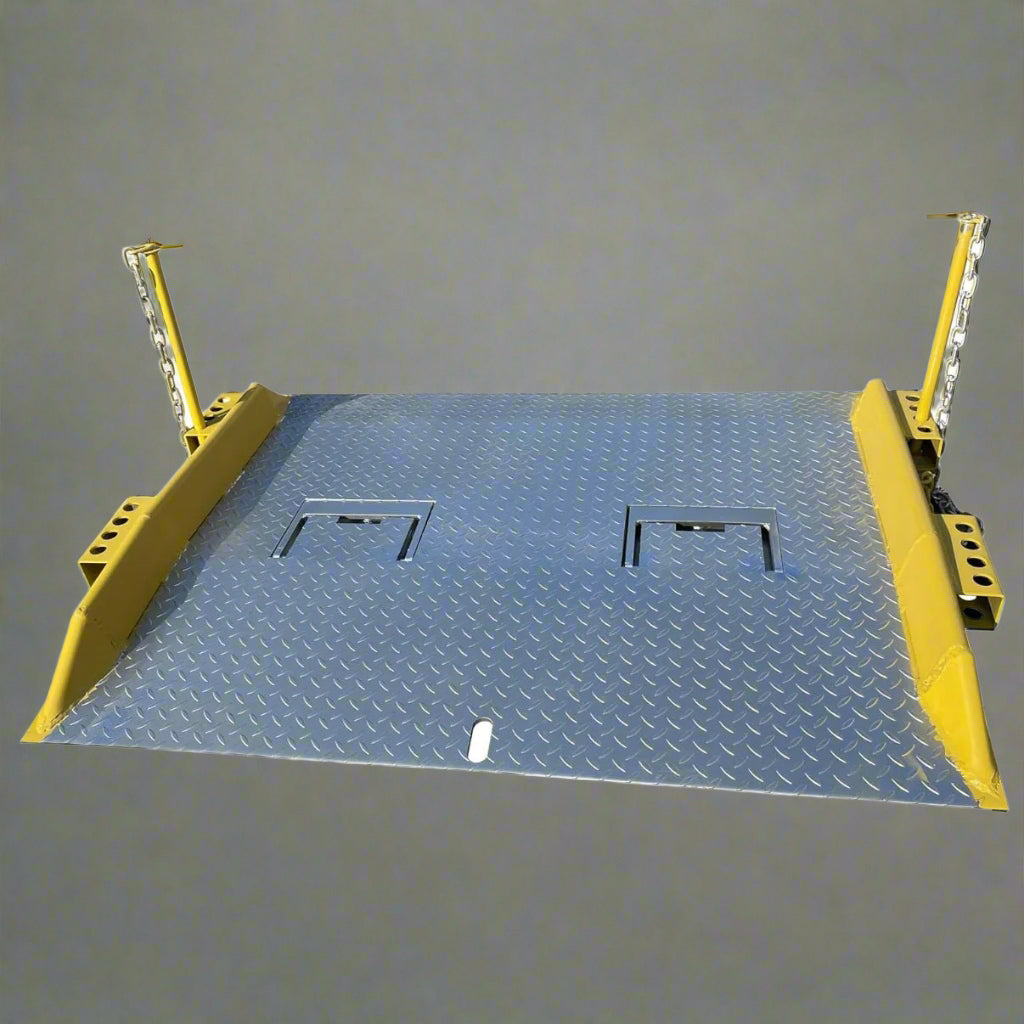 Heavy-duty steel loading dock ramp on warehouse floor

Industrial dock ramp with yellow safety rails

Forklift-ready steel dock board in use

Side view of 15,000 lb steel dock ramp

Loading dock ramp with chain attachment system