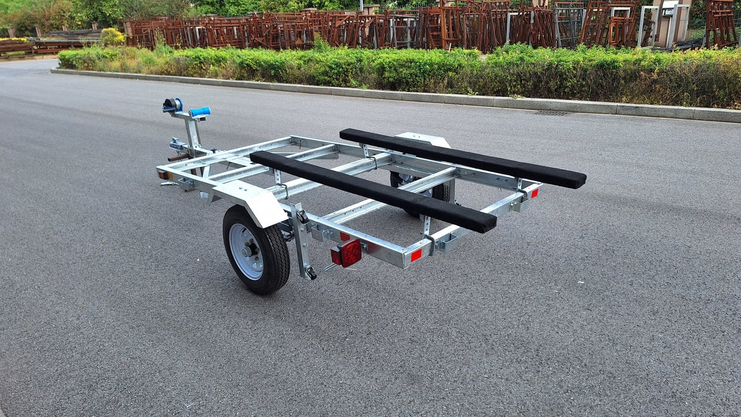 Heavy-duty galvanized 4x8 folding utility trailer with checker plate deck and road-ready tires