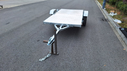 Heavy-duty galvanized 4x8 folding utility trailer with checker plate deck and road-ready tires