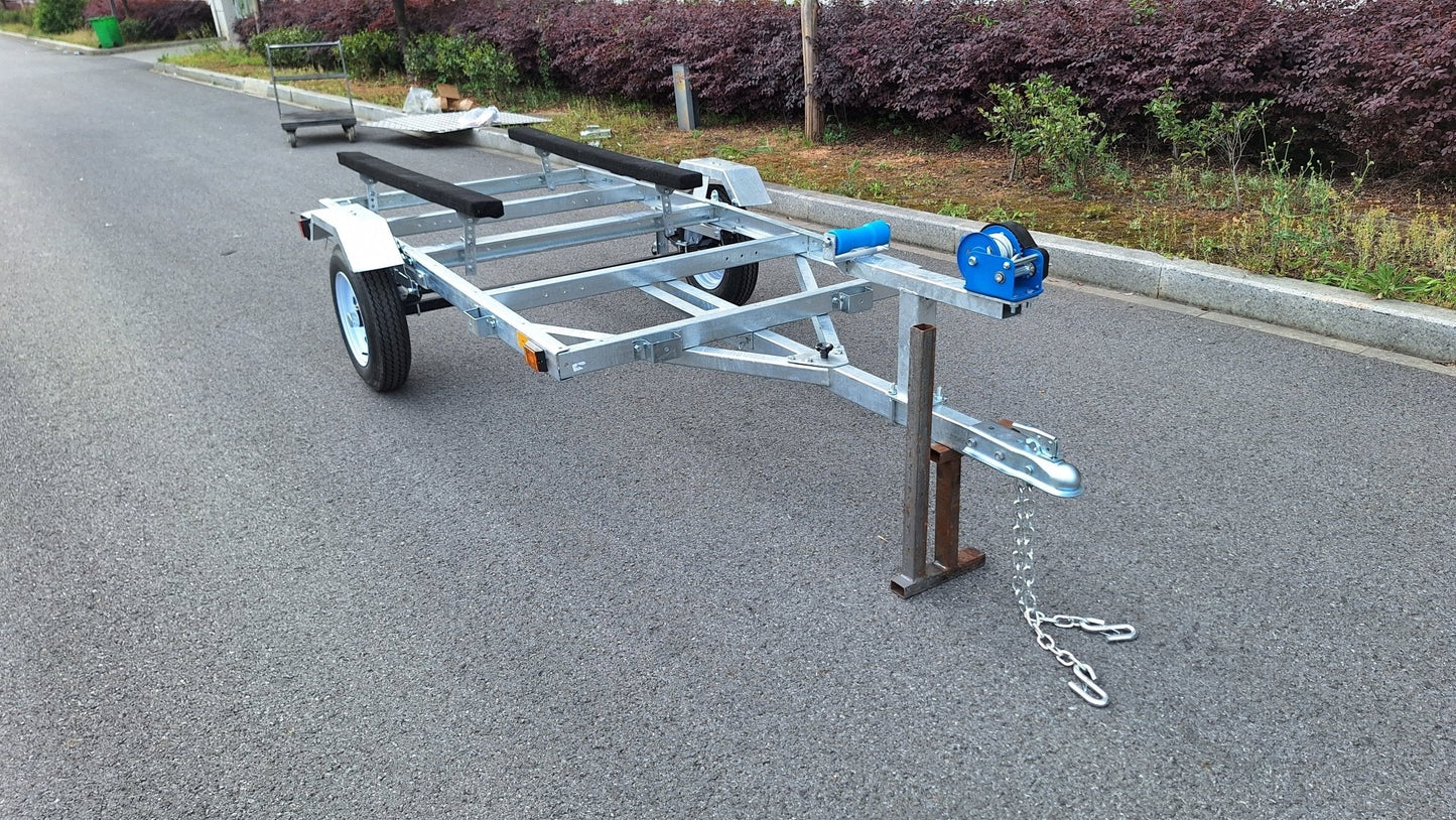 Heavy-duty galvanized 4x8 folding utility trailer with checker plate deck and road-ready tires