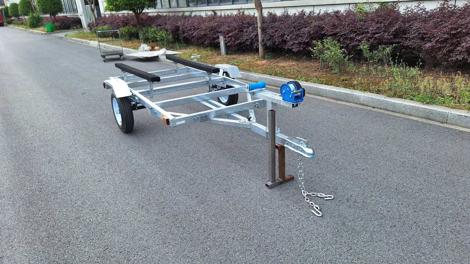 Heavy-duty galvanized 4x8 folding utility trailer with checker plate deck and road-ready tires