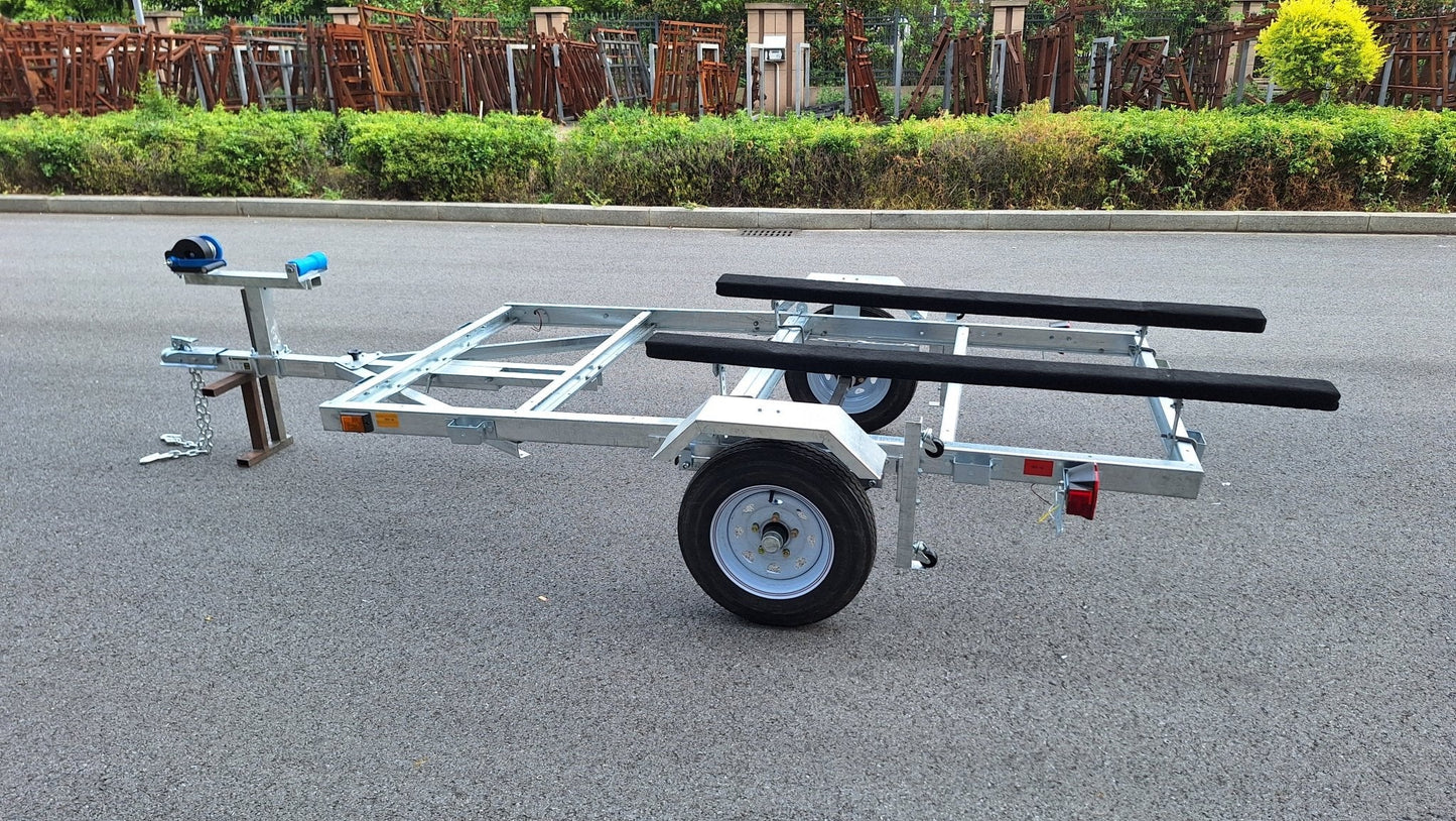 Heavy-duty galvanized 4x8 folding utility trailer with checker plate deck and road-ready tires