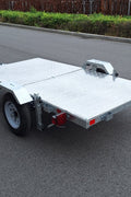 Heavy-duty galvanized 4x8 folding utility trailer with checker plate deck and road-ready tires