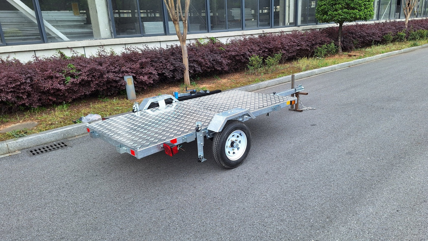 Heavy-duty galvanized 4x8 folding utility trailer with checker plate deck and road-ready tires