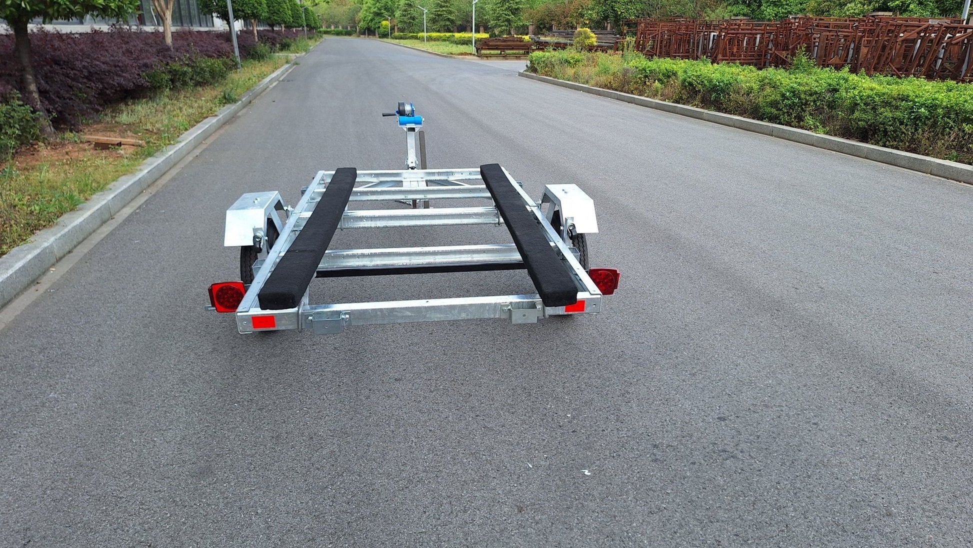 Heavy-duty galvanized 4x8 folding utility trailer with checker plate deck and road-ready tires