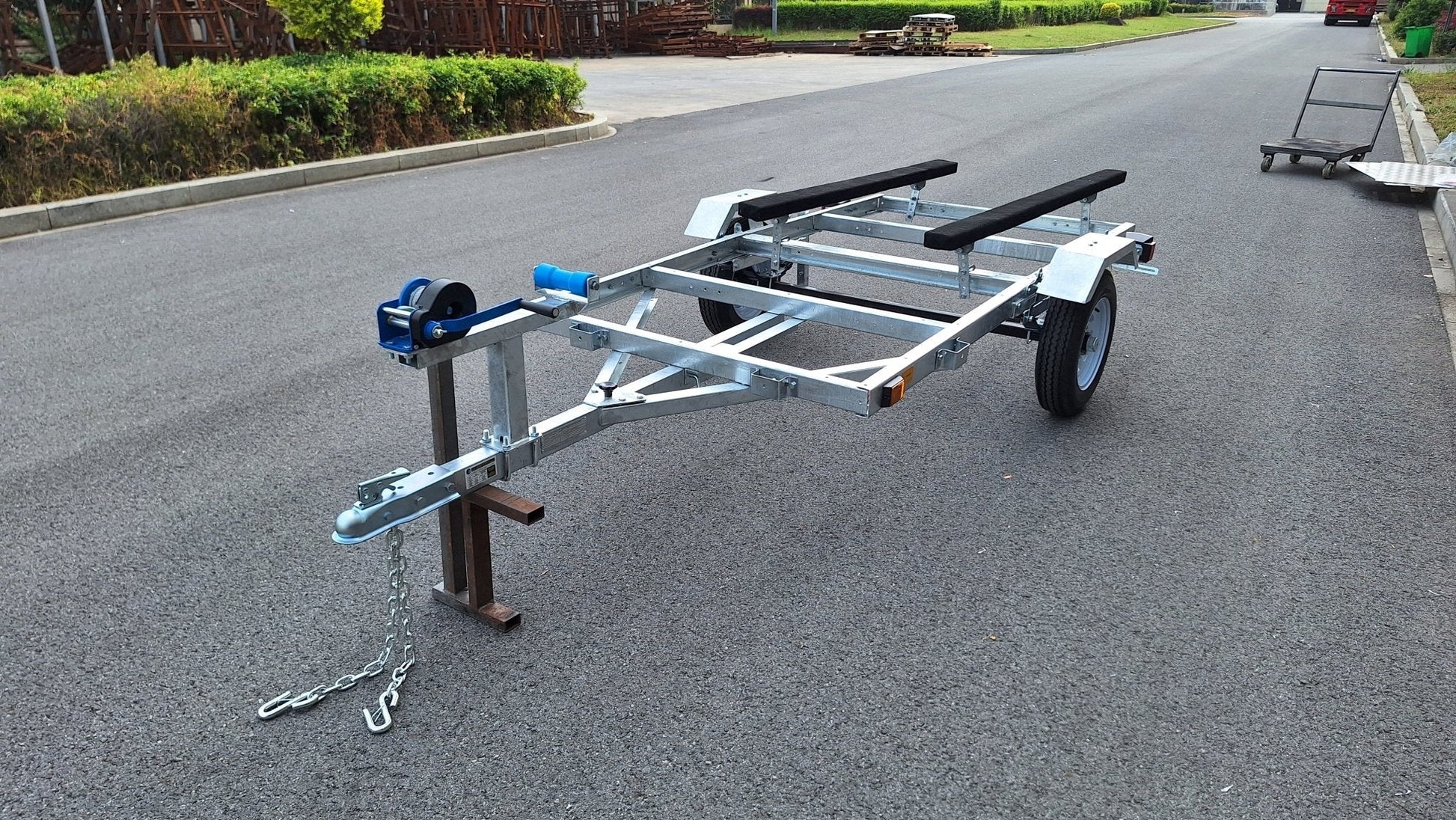 Heavy-duty galvanized 4x8 folding utility trailer with checker plate deck and road-ready tires
