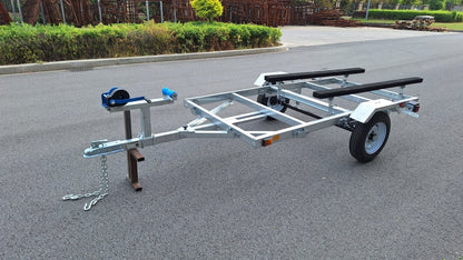 Heavy-duty galvanized 4x8 folding utility trailer with checker plate deck and road-ready tires