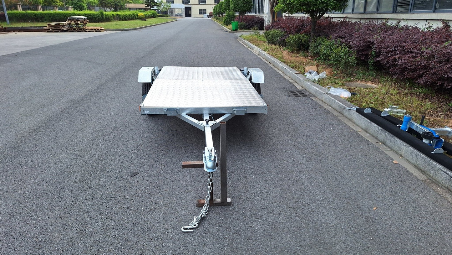 Heavy-duty galvanized 4x8 folding utility trailer with checker plate deck and road-ready tires
