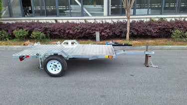Heavy-duty galvanized 4x8 folding utility trailer with checker plate deck and road-ready tires