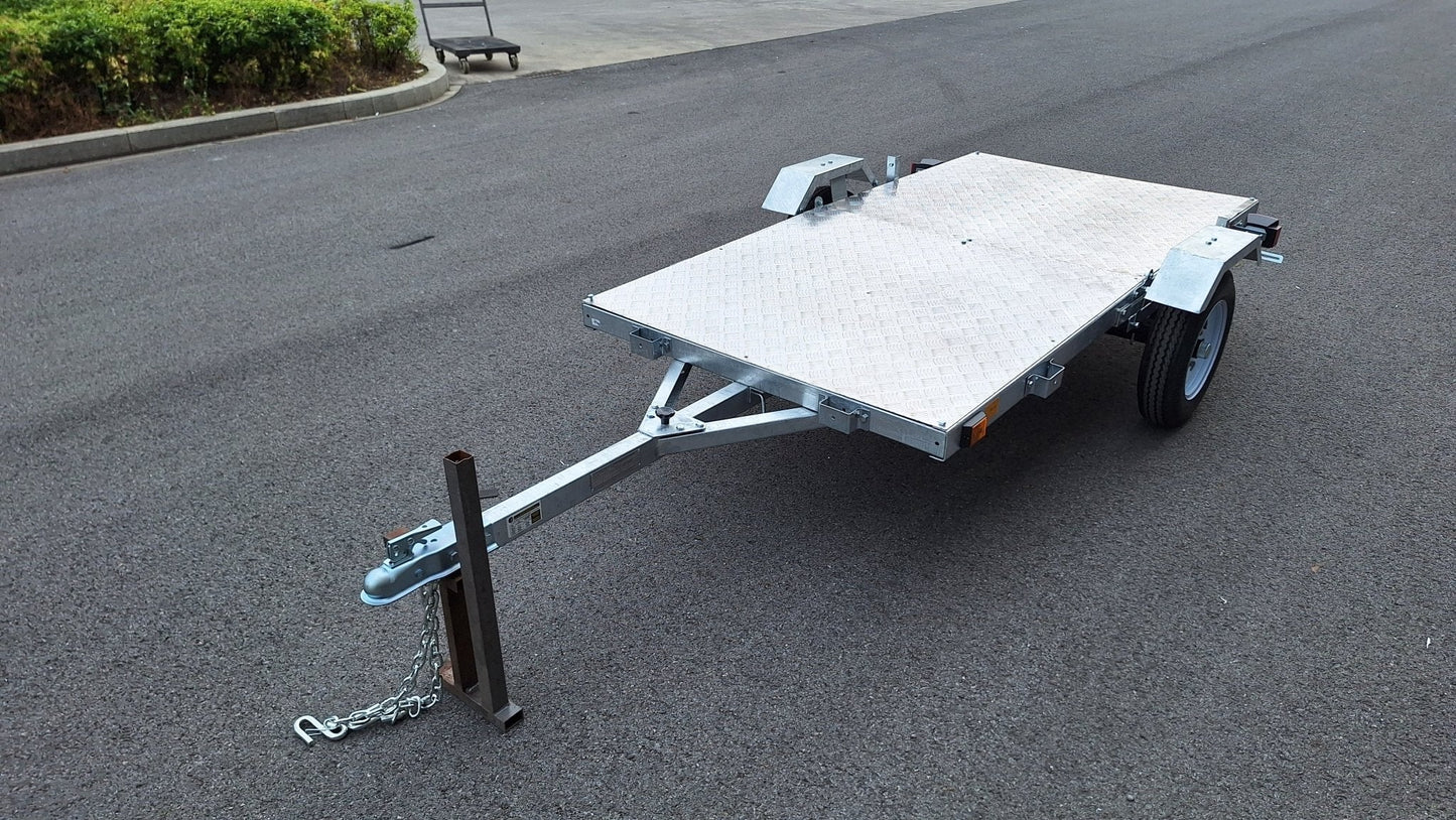 Heavy-duty galvanized 4x8 folding utility trailer with checker plate deck and road-ready tires
