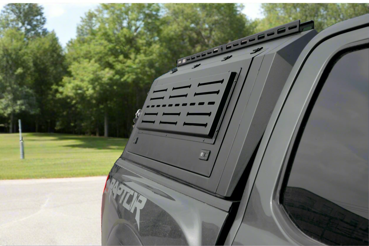 Side view of heavy-duty steel truck topper on black pickup
Modular canopy with open gullwing side door
Lockable utility cap rear view
Installation components of modular truck canopy
Steel topper installed on full-size pickup truck