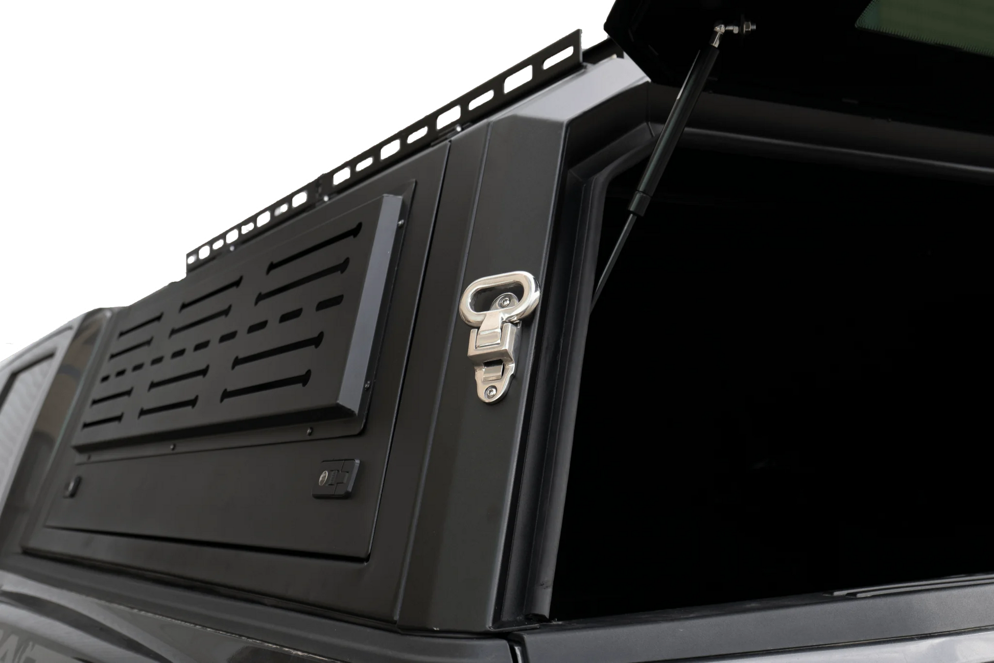 Side view of heavy-duty steel truck topper on black pickup
Modular canopy with open gullwing side door
Lockable utility cap rear view
Installation components of modular truck canopy
Steel topper installed on full-size pickup truck