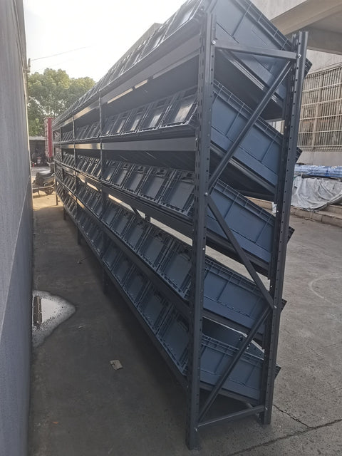 SR81050 heavy-duty steel storage rack with slanted shelves
Industrial warehouse rack system with 4 bays
Slanted shelving system for commercial equipment storage
Close-up view of steel rack frame and shelf detail
High capacity industrial racking with powder-coated finish