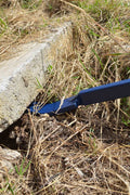 Heavy-duty 46-inch blue pry bar angled view

Pry bar in action pulling concrete formwork

Close-up of beveled tip and rubber handle

Construction site use of pry bar tool